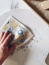 Load image into Gallery viewer, Sun, Clouds and Potato People Sponge Cloth